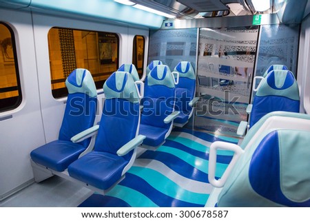 DUBAI, UAE - 31 MARCH 2014: Metro line interior in Dubai, UAE. The Dubai Metro is a driverless, fully automated metro rail network in the city of Dubai and carry over 180,000 passengers every day.