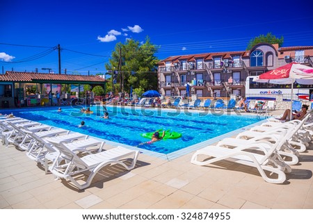LAGANAS, GREECE - AUG 21, 2015: Swimming pool at the Perkes hotel in Laganas town of Zakynthos island, Greece.