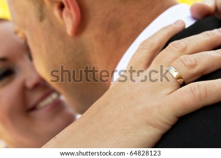 Wedding ring on her finger