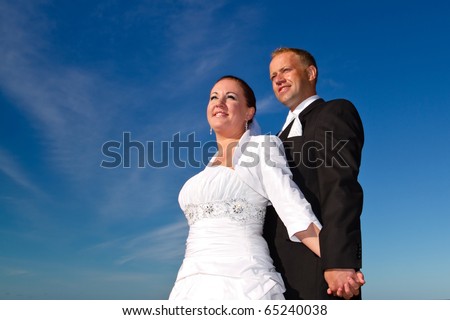 Wedding photo session under blue sky