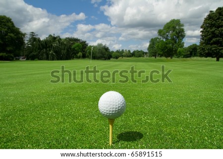 Golf ball on tee in a beautiful golf club