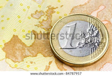 Euro coin on euro map from banknote revers