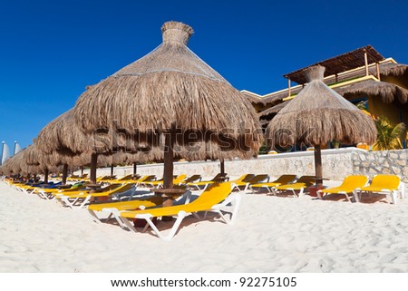 Holidays under parasol at Caribbean Sea of Mexico