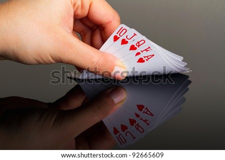 King poker in the hand with reflection