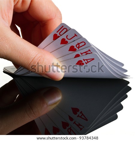 Royal poker in the hand with reflection