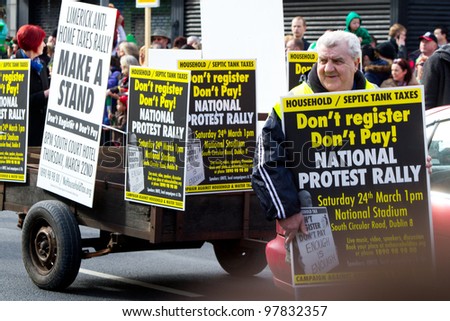 LIMERICK, IRELAND - MARCH 17: Unidentified man with protest transparent participate in parade for St. Patrick\'s Day. It\'s a traditional Irish holiday celebration. March 17, 2012 in Limerick, Ireland.