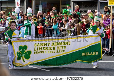 LIMERICK, IRELAND - MARCH 17: Unidentified children participate in a parade for St. Patrick\'s Day. It\'s a traditional Irish holiday celebration. March 17, 2012 in Limerick, Ireland.