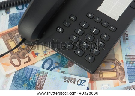black telephone on money background