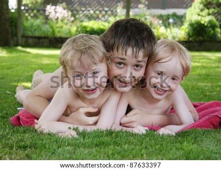 Three brothers having fun in the garden