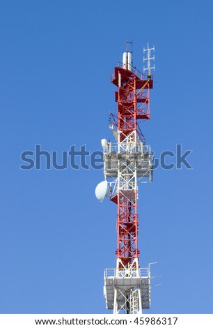 image of communication mobile internet antenna over a blue sky background