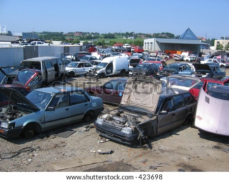 stock photo A bunch of wrecked cars at a scrapyard