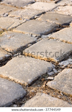 Cobblestones are stones that were frequently used in the pavement of early streets.