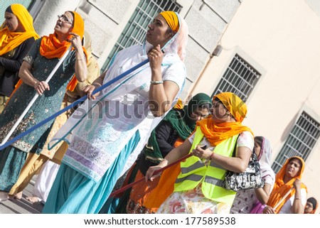 CREMONA - APRIL 13: women group of the Sikh religion in procession through the spring festival Vaisakhi, April 13, 2013 in Cremona, Lombardia, Italy. the Sikh festival takes place every year.