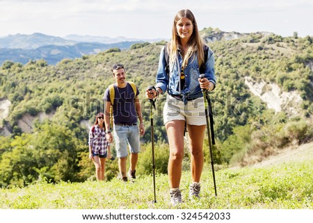 group of hikers in the mountain in single file