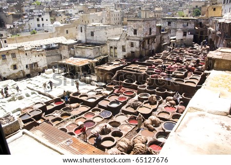 FES, MOROCCO, AFRICA - APRIL 10: men at work in a tannery in Fes on April 10, 2010 in Fes, Morocco, Africa. Tannery is the best resource of work in the city of Morocco