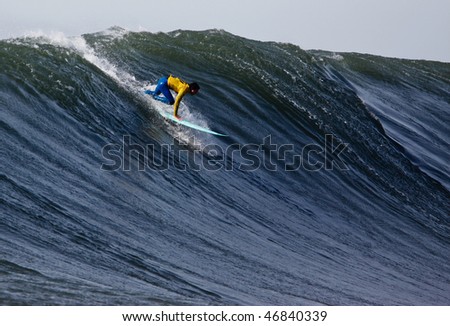 HALF MOON BAY, CA - FEBRUARY 13: Shane Desmond catches a wave in the 2009/2010 Mavericks Surf Contest February 13, 2010 in Half Moon Bay, California