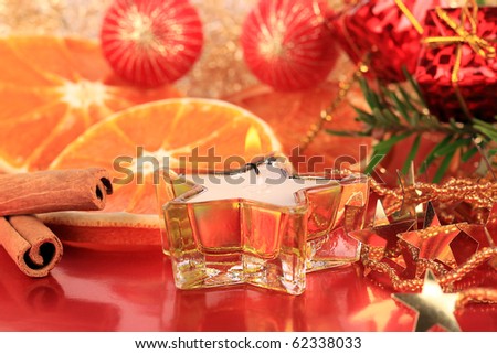 A Christmas still life with oranges and cinnamon