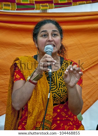 EXETER -  JUNE 2: Sandhya Dave telling Indian Tales in the Story Telling Tent at the Exeter Respect Festival 2012 on June 2, 2012 in Exeter, UK