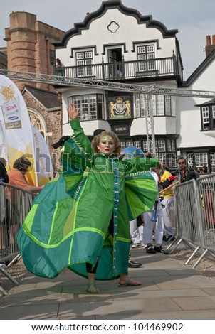 EXETER - MAY 18: The Lady of the Wind, Emma-Rose, dances through the streets of Exeter as part of the Battle for the Winds Parade on May 18, 2012 in Exeter, UK