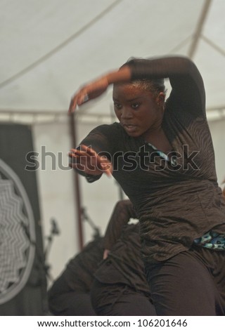 EXETER - JUNE 3: Dancer from State of Emergency Dance Company perform live on the Global Community Stage at the Exeter Respect Festival 2012l on June 3, 2012 in Exeter, UK