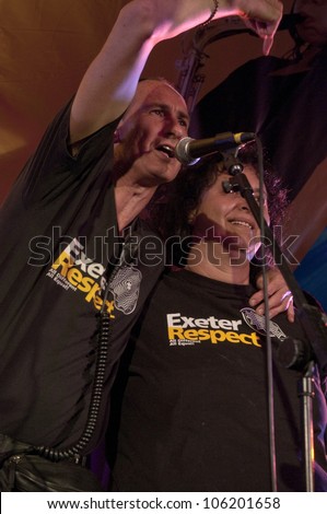 EXETER - JUNE 3: Exeter Respect organisers Paul Giblin and Dr. Suaad George giving thanks to the crowd in the World Big Top at the Exeter Respect Festival 2012 on June 3, 2012 in Exeter, UK