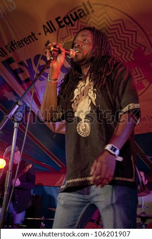 EXETER - JUNE 3: Kuron King from the Afro-Funk band Bronzehead performing live in the World Big Top at the Exeter Respect Festival 2012 on June 3, 2012 in Exeter, UK
