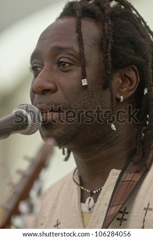  - stock-photo-exeter-june-senegalese-singer-songwriter-amadou-diagne-performing-live-in-the-acoustic-cafe-106284056