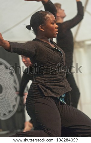 EXETER - JUNE 3: Dancer from State of Emergency Dance Company perform live on the Global Community Stage at the Exeter Respect Festival on June 3, 2012 in Exeter, UK