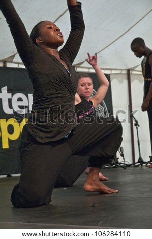 EXETER - JUNE 3: Dancers from State of Emergency Dance Company perform live on the Global Community Stage at the Exeter Respect Festival on June 3, 2012 in Exeter, UK