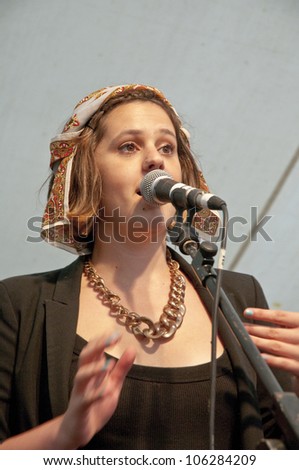 EXETER - JUNE 3: Singer from University of Exeter Soul Choir perform live on the Global Community Stage at the Exeter Respect Festival on June 3, 2012 in Exeter, UK