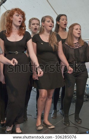 EXETER - JUNE 3: Singers from University of Exeter Soul Choir perform live on the Global Community Stage at the Exeter Respect Festival on June 3, 2012 in Exeter, UK