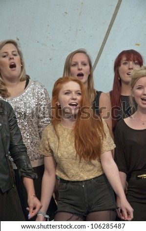 EXETER - JUNE 3: Singers from University of Exeter Soul Choir perform live on the Global Community Stage at the Exeter Respect Festival on June 3, 2012 in Exeter, UK