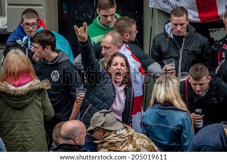 EXETER, UK - NOVEMBER 16: English Defence League member shouting out during the English Defence League march and rally November 16, 2013 in Exeter, Devon, UK