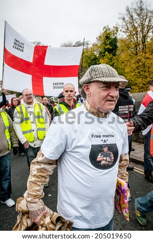 EXETER, UK - NOVEMBER 16: English Defence League rally leader walking along New North Street during the English Defence League march and rally November 16, 2013 in Exeter, Devon, UK