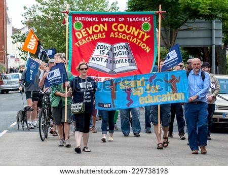 EXETER - JULY 10: The J10 march walks along Sidwell Street during the public sector workers national day of action in  Exeter City Centre on July 10,  2014 in Exeter, Devon, UK