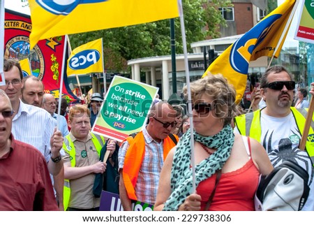 EXETER - JULY 10: PCS members walk into Princesshay Square during the public sector workers national day of action in Exeter City Centre on July 10,  2014 in Exeter, Devon, UK