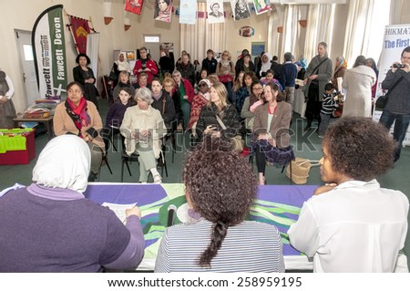 EXETER, ENGLAND - MARCH 7, 2015: The speakers address the audience at the Mosque during the Walk for Peace through the city of Exeter to celebrate International Women\'s Day.