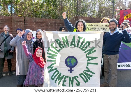 EXETER, ENGLAND - MARCH 7, 2015: Devon women celebrate at Exeter Mosque during the Walk for Peace through the city of Exeter to celebrate International Women\'s Day.