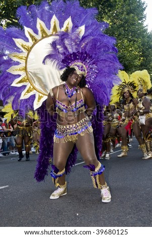 NOTTING HILL, LONDON - AUG 31: Dancer in a large costume from the Baccanalis float at Notting Hill Carnival on August 31 2009 in London, UK.