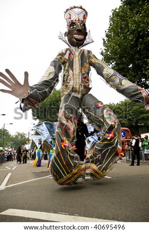 LONDON - AUGUST 25: A giant dancing man from the Sunshine International float during the Notting Hill Carnival on August 25, 2008 in London, England.