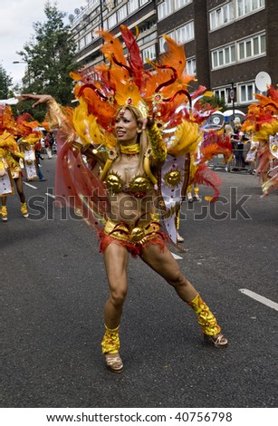 LONDON - AUGUST 31: A dancer from the Paraiso School of Samba float during the Notting Hill Carnival August 31, 2009 in London, England.