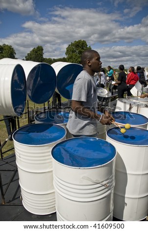 LONDON – AUGUST 29: Steel-drummer from  Bandoleers Steelband plays steel drum at the Notting Hill Panorama Championships on August 29, 2009 in Hyde Park, London, England.
