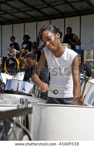 LONDON – AUGUST 29: Steel-drummers from  Bandolers Steelband play steel drum at the Notting Hill Panorama Championships on August 29, 2009 in Hyde Park, London, England.