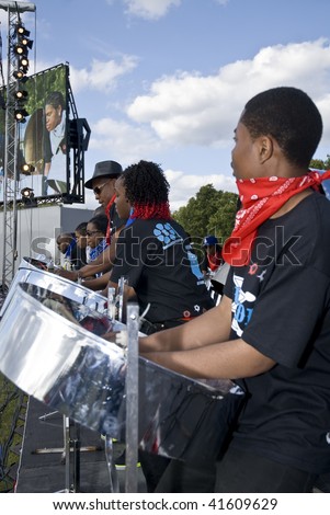 LONDON – AUGUST 29: Steel-drummers from the Bandoleers Steel-band  play steel drums at the Notting Hill Panorama Championships on August 29, 2009 in Hyde Park, London, England.