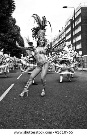 LONDON - AUGUST 31: Dancers from the London School of Samba float dancing on the street at the Notting Hill Carnival on August 31, 2009 in London, England.