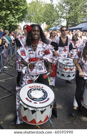 NOTTING HILL, LONDON - AUG 31: Drummers from Batala Banda de Percussao perform on the streets of London at the Notting Hill Carnival street parade on August 30, 2010 in Notting Hill, London, England