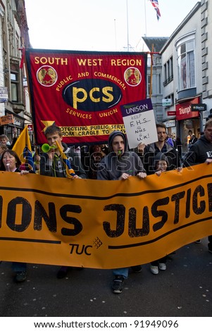 EXETER - NOVEMBER 30: Striking public sector workers march through Exeter City centre as part of the national protest againt changes to public sector pensions  on November 30, 2011 in Exeter, UK