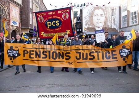 EXETER - NOVEMBER 30: Striking public sector workers march through Exeter City centre as part of theprotest against proposed changes to public sector pensions  on November 30, 2011 in Exeter, UK