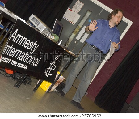 EXETER - NOVEMBER 01: Oliver Sprague, Programme Director Arms Control, AIUK  speaking at the Amnesty International South West on November 01, 2008 in Exeter, UK.