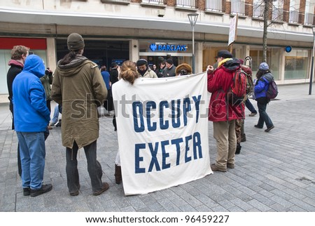 EXETER - FEBRUARY 11: Occupy Exeter activist take part in a  general assembly meeting outside the Exeter branch of Barclays Bank  on February 11, 2012 in Exeter, UK